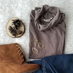 Sleeveless brown turtle neck top